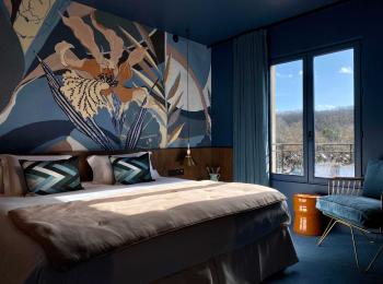 lit de la chambre prestige - hotel spa yvelines